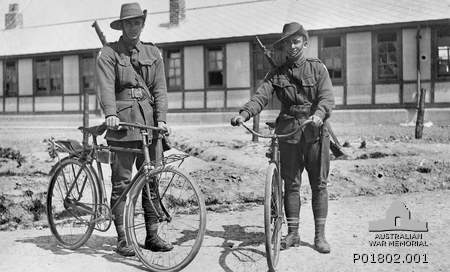 Henencourt, France. 1917. Two members of the 1st Anzac Cyclists Battalion standing, with their bicycles, in front of their barracks. 827 Private Jack Dair Bambury (left) and 830 Private Herbert (Terry) Davies.